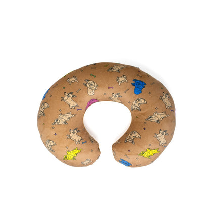 The Corey the Puppy 2-In-1 Travel Pillow is a U-shaped brown neck pillow with adorable cartoon dog designs in plush colors like blue, yellow, and pink against a white background.