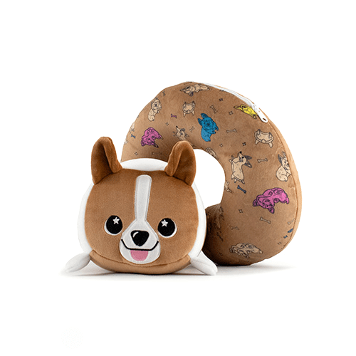 Corey the Puppy 2-In-1 Travel Pillow is a soft, brown neck pillow with a corgi face, large eyes, and a smile. It features a delightful pattern of various colorful dog illustrations.