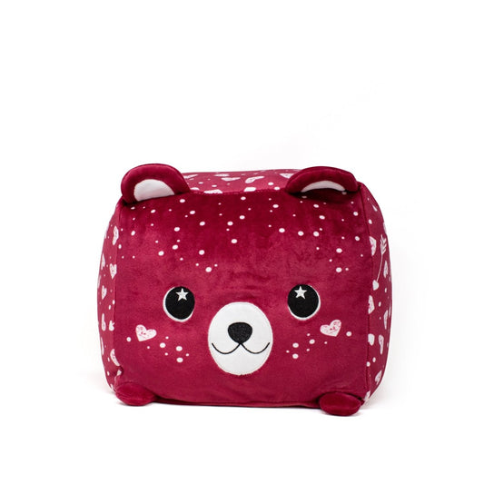 Cupid the Bear Plushie is a cube-shaped, deep red toy adorned with heart patterns on the sides and features a smiling face, big black and white eyes, and protruding ears for an extra cute appearance against a white background.