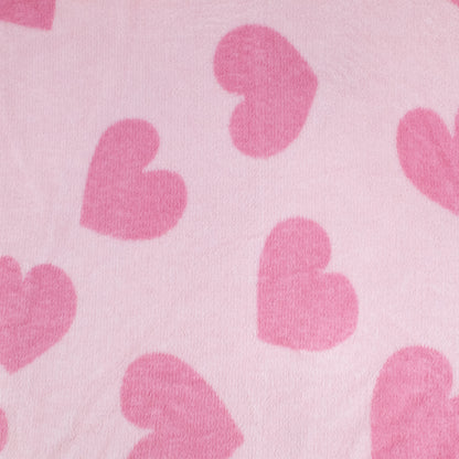 A soft, light pink kids fleece blanket with darker pink heart shapes—perfect for snuggling or as a 2-in-1 Pillow Blanket featuring Doe the Deer from Moosh-Moosh.