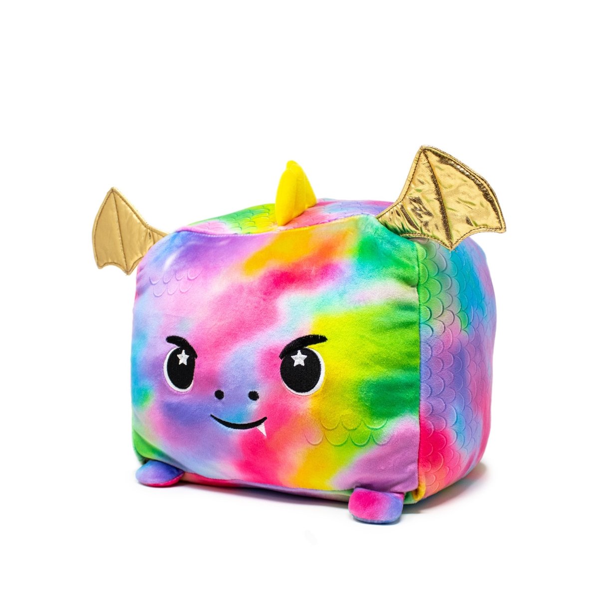 Emery the Dragon Plushie is a cube-shaped, colorful plush toy adorned with a vibrant tie-dye pattern. It features a cheerful face with starry eyes, a small yellow horn, and golden bat-like wings, enhancing its irresistibly soft charm.