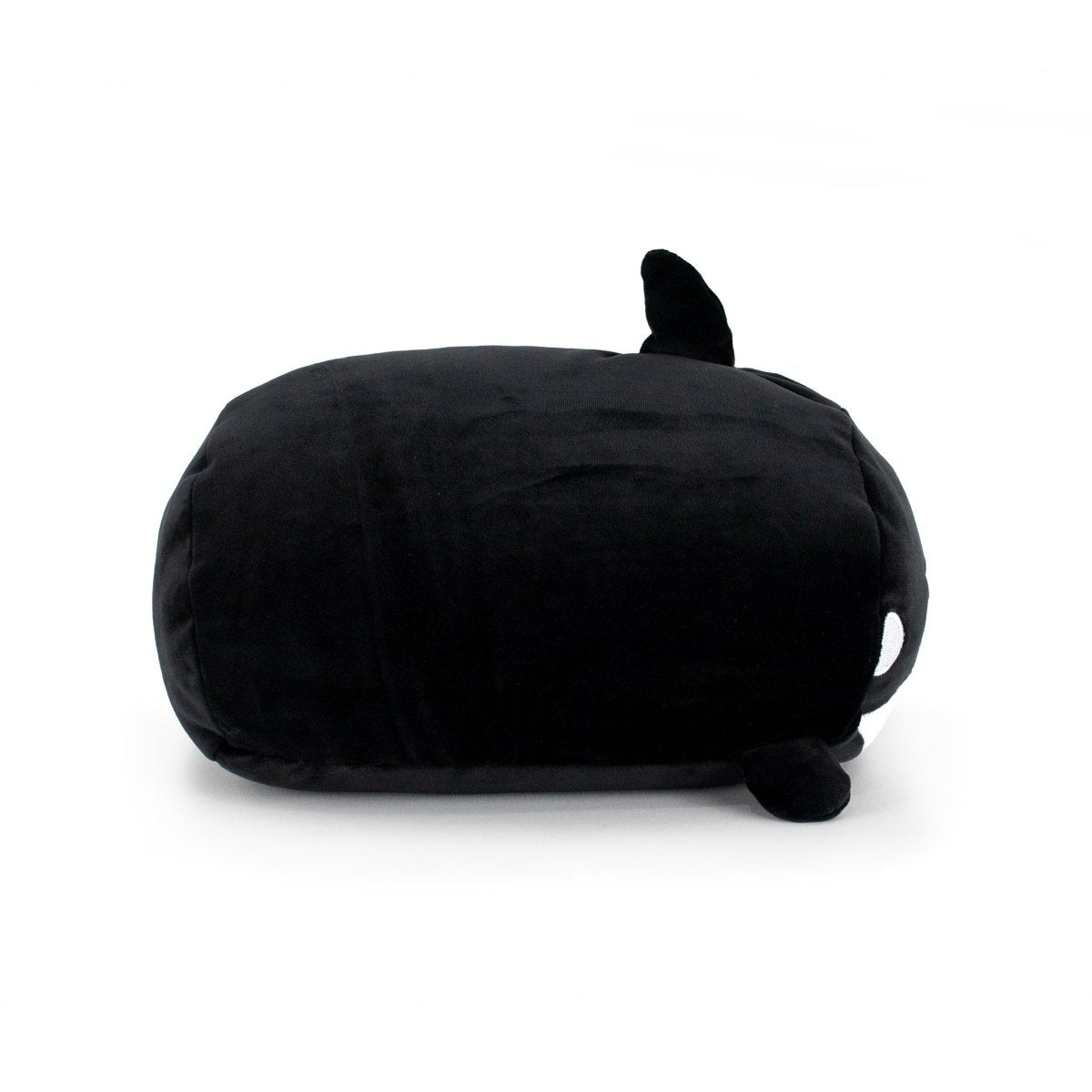Fausto the Orca is a plush toy shaped like a black whale with small fins, a dorsal fin, and a white spot near its eye, shown on a plain white background.