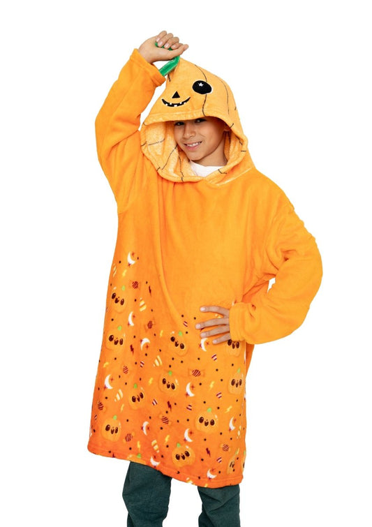 A child smiles while wearing the Vincent the Pumpkin Hooded Blanket, featuring a pumpkin face and stem on the hood and small pumpkins on the bottom half—perfect for a cozy Halloween.