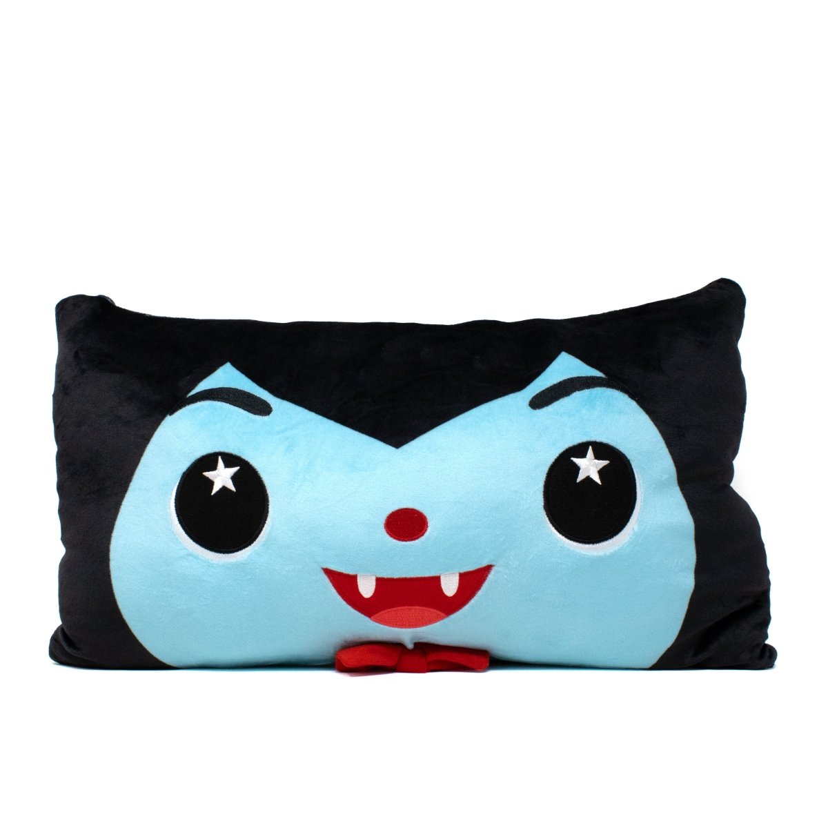 A rectangular plush pillow featuring a cartoon vampire face with a light blue complexion, pointy fangs, and star-shaped eyes.