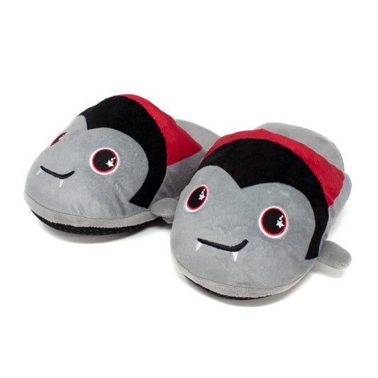 Bram the Vampire Halloween Slippers are plush gray slippers styled as cute cartoon vampires with black hair, red bands, pointy ears, starry round eyes, and smiling mouths with fangs—perfect for cozy Halloween wear.