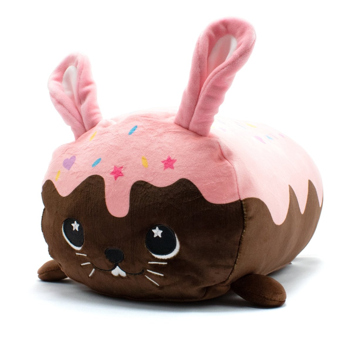 Harry the Bunny Plushie is a cute round animal plushie with brown fur, a pink frosted top with colorful sprinkles, big eyes, small feet, and two long pink ears. It combines dessert charm with an adorable creature appeal.