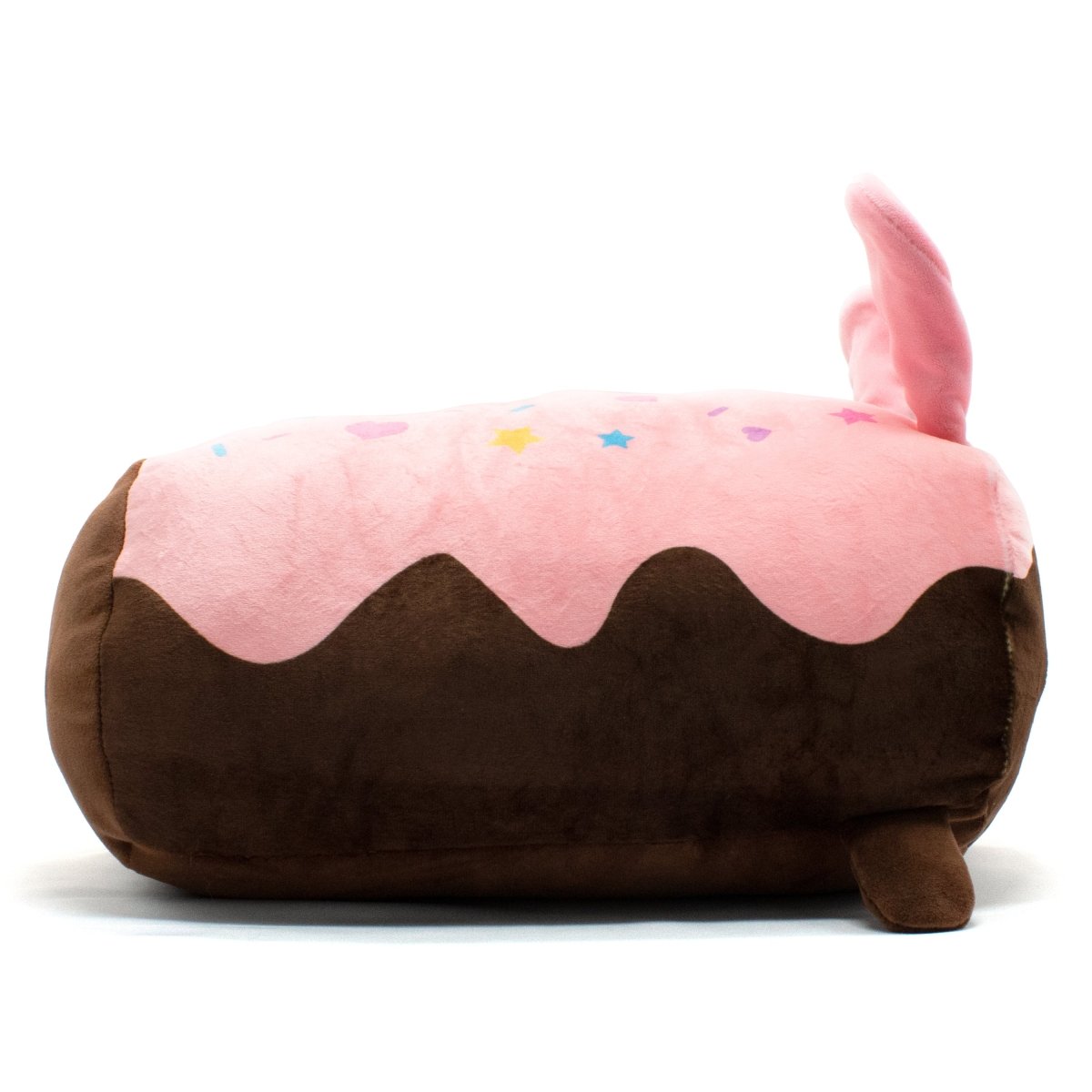 Harry the Bunny Plushie is a dessert roll-shaped toy with a soft pink top, adorned with colorful star decorations and a brown base, featuring a playful pink tail protruding from the top.