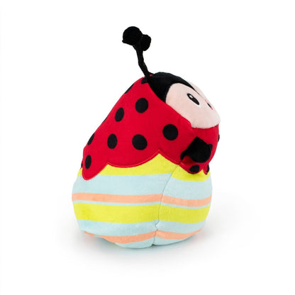 Dot the Ladybug Hatchling is a plush toy featuring a red body with black spots, a smiling face with antennae, and pastel striped patterns on its colorful abdomen. It sits upright and is made from soft, cuddly fabric, making it perfect for Easter baskets.