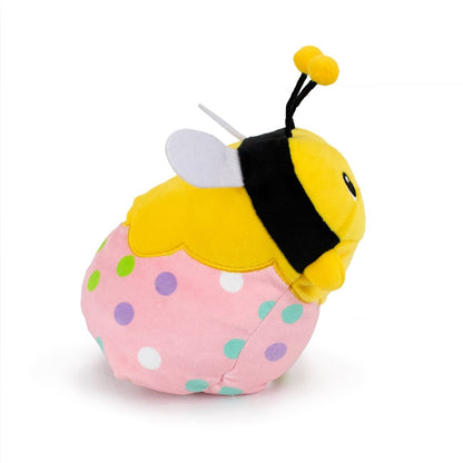 Vee the Bee Hatchling is a charming plush toy with a yellow body, black antennae, white wings, and a pink round bottom featuring colorful polka dots. Its sensory softness makes it perfectly huggable as it sits charmingly against a white background.