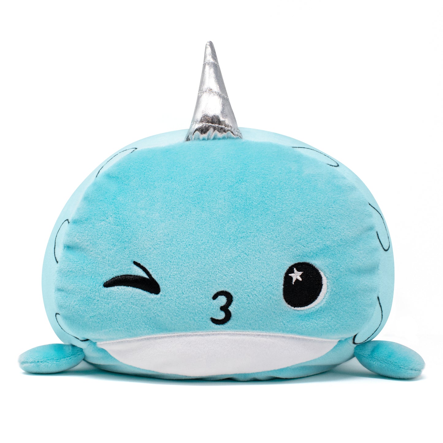 Hershel the Narwhal Plushie is a cute, round blue stuffed animal with a silver unicorn horn. It features a winking face on one side, an open eye on the other, and resembles a whale with small side fins.