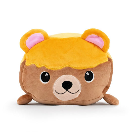 Introducing Honey the Bear Plushie, a cuddly cube from Moosh-Moosh with a cute bear face. It features light brown ears with pink inner sections, black and white eyes, and is topped with golden plush fabric for hair on its light brown body.