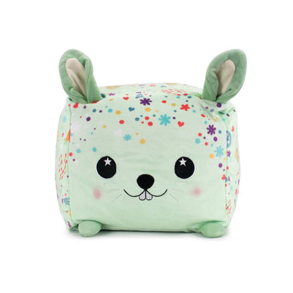 Introducing Hoppy the Bunny Plushie from the Plush Pals collection—a soft, square-shaped toy in light green with starry eyes. Adorned with pink, purple, yellow, and teal floral patterns and featuring light pink inner ears and rounded feet for a sensory-soft cuddle buddy.