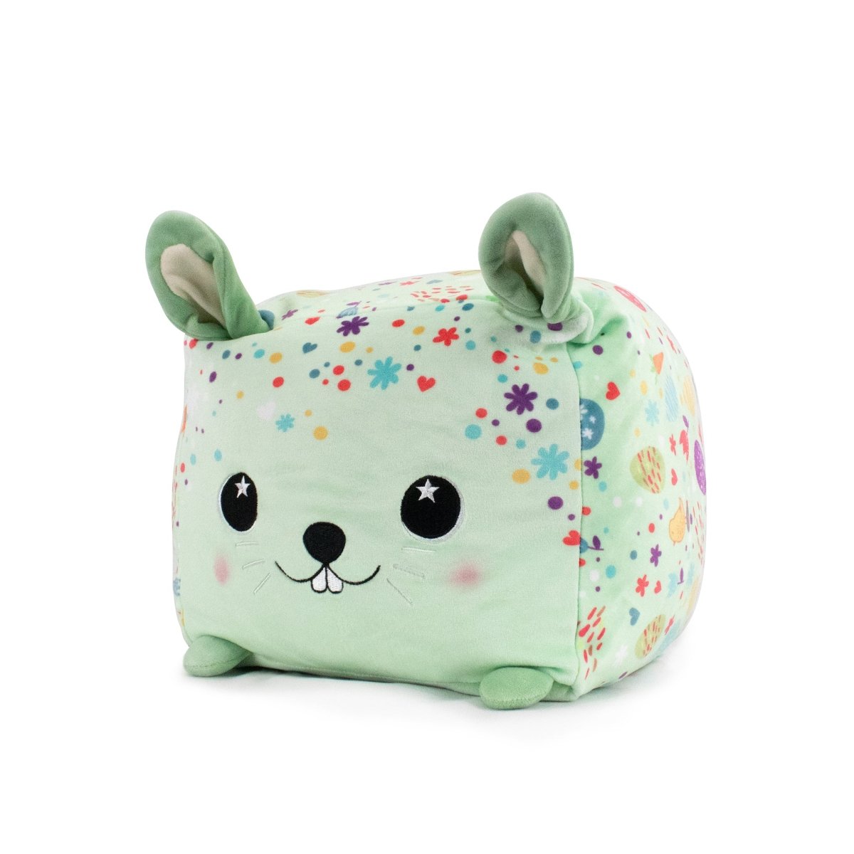 Hoppy the Bunny Plushie is an adorable cube-shaped plush featuring a charming bunny face. It has large ears, small feet, and a joyful expression. The mint green fabric with colorful stars, hearts, and dots offers sensory softness perfect for snuggles.