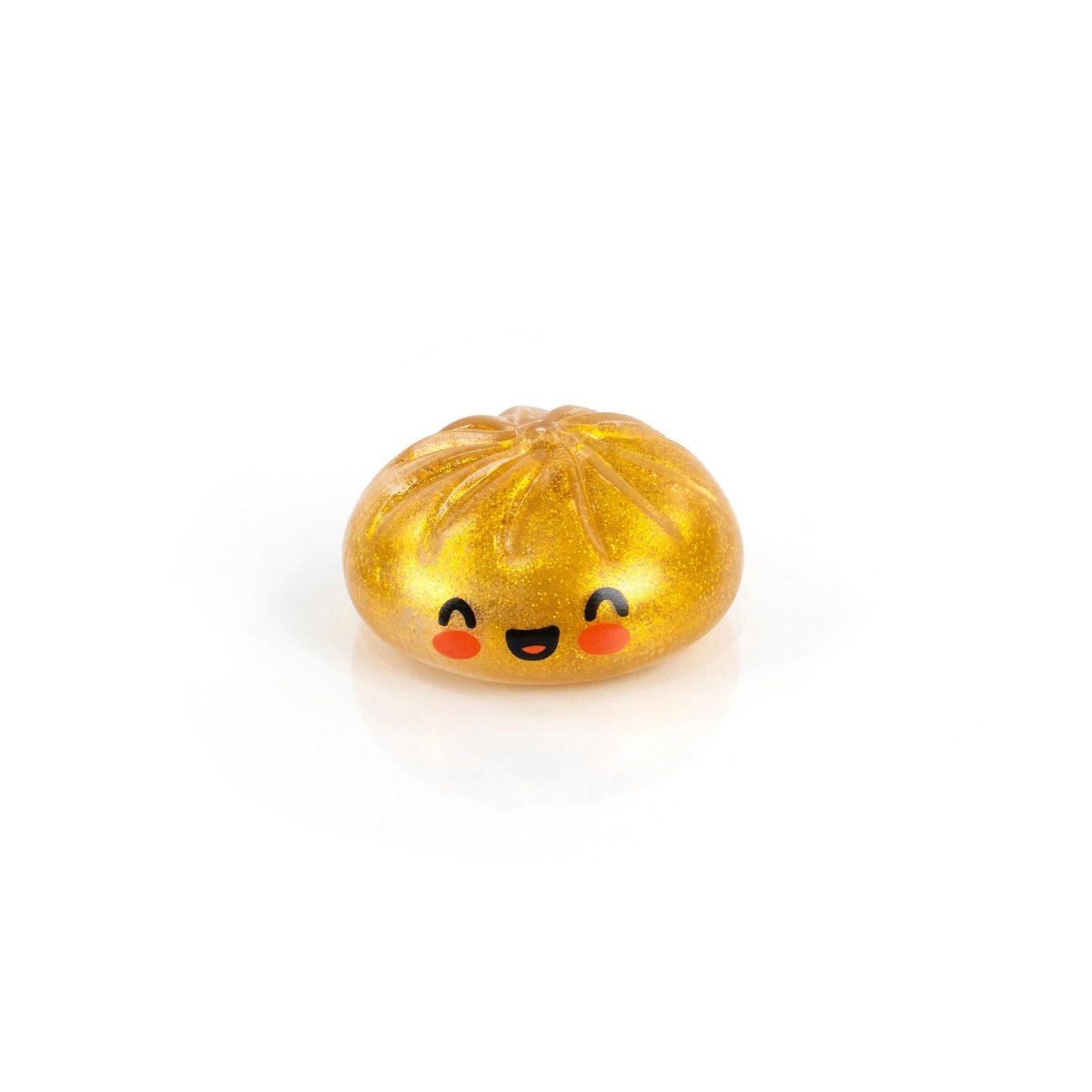 Bubblegum's Favorite Toy - Mystery Dumpling is a golden, glittery squishy with a smiling face and rosy cheeks, centered on a white background—the perfect stress relief toy.