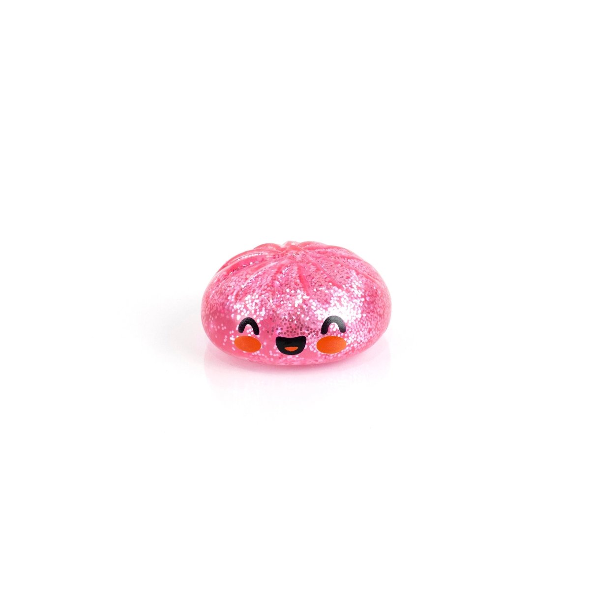 Bubblegum's Favorite Toy - Mystery Dumpling is a small, round, pink glittery squishy with a smiling face and blushing cheeks, perfect as a stress relief toy to add sweetness to your space.