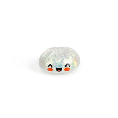 Bubblegum's Favorite Toy - Mystery Dumpling is a small, clear, glittery squishy shaped like a dumpling with a smiling face and rosy cheeks—perfect as a cute stress relief toy.