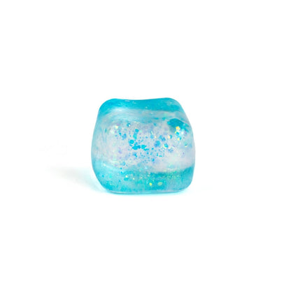Bubblegum's Favorite Toy - Glitter Sugah-mals Cubes: a translucent blue squishy cube with glitter and iridescent flecks, perfect as a stress relief toy or decorative piece, shown on a white background.