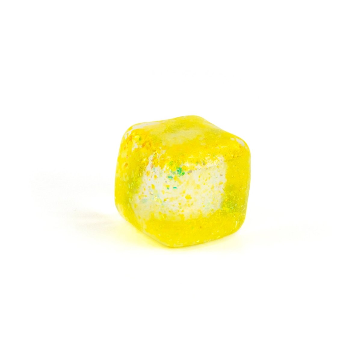 A yellow, translucent, squishy cube-shaped candy with a white center and colorful specks, inspired by Bubblegum's Favorite Toy - Glitter Sugah-mals Cubes, displayed on a plain white background.