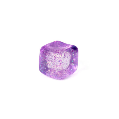 A single Bubblegum's Favorite Toy - Glitter Sugah-mals Cubes v.2 in translucent purple with glitter specks, set on a plain white background—perfect as a squishy stress relief toy.