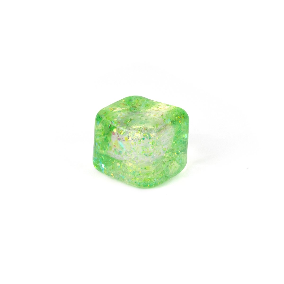 A single translucent green Bubblegum's Favorite Toy - Glitter Sugah-mals Cube v.2 with gold flecks sits on a plain white background, making it a unique and fun stress relief toy.