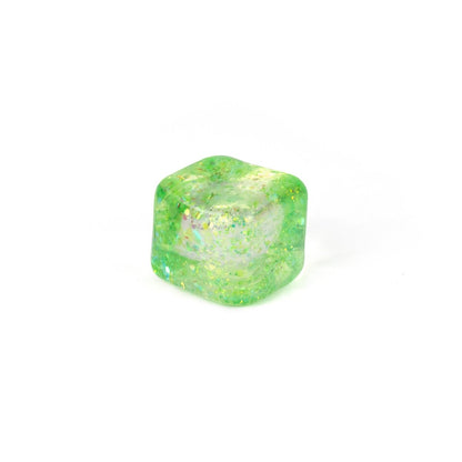 A single translucent green Bubblegum's Favorite Toy - Glitter Sugah-mals Cube v.2 with gold flecks sits on a plain white background, making it a unique and fun stress relief toy.