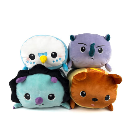 Four plushies from the Limited Edition Bundle are stacked two by two: a white and blue bird, a purple rhino, a teal lion with black mane, and a brown bear—all crafted for sensory softness and huggable comfort.