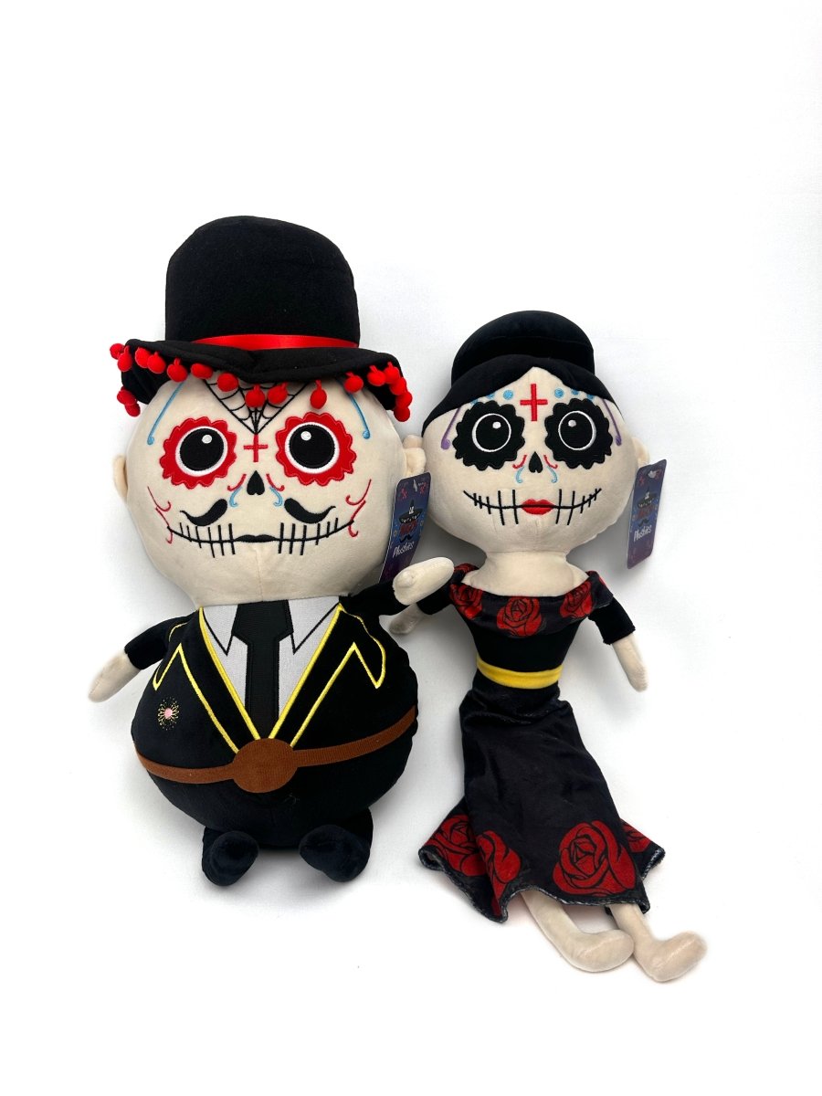 The Lil 'Migos Day of the Dead Plush features a bride and groom with classic face paint, bold red accents, and festive outfits—blending traditional Día de los Muertos style with soft, huggable comfort.