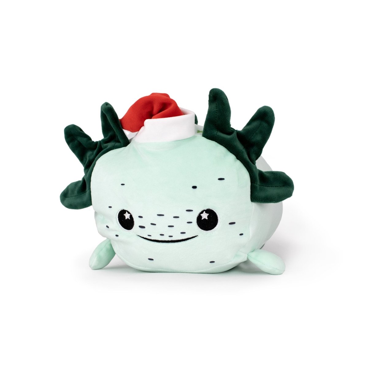 Ivy the Axolotl is a plush toy shaped like a smiling light-green axolotl with dark green frills, small black eyes, and a red Santa hat—one of our ultra-soft, cuddly plush buddies.