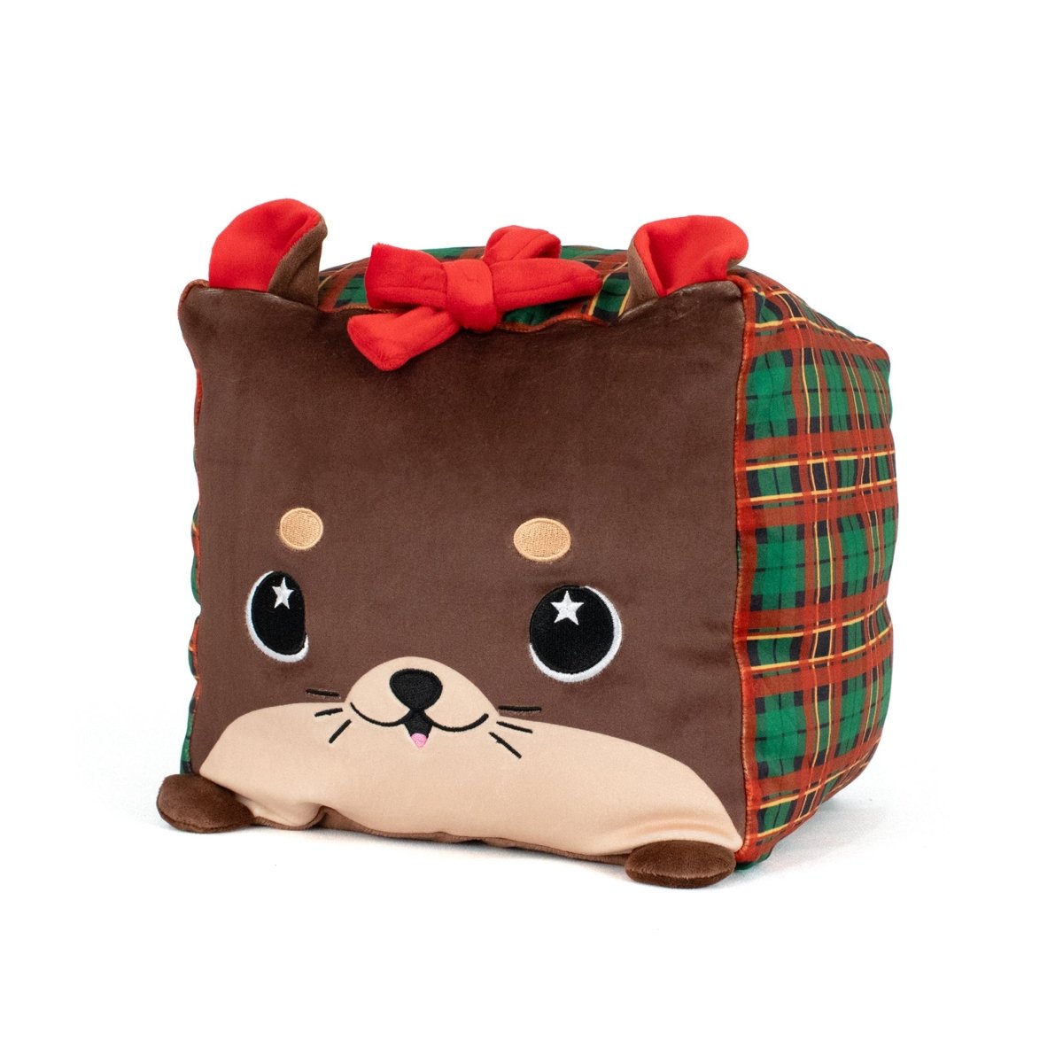 Joy the Otter is a cube-shaped plush with a brown otter face, plaid sides, red bow, small ears, big round eyes, and a cute smile. This festive design makes Joy one of the must-have stuffed plushies.