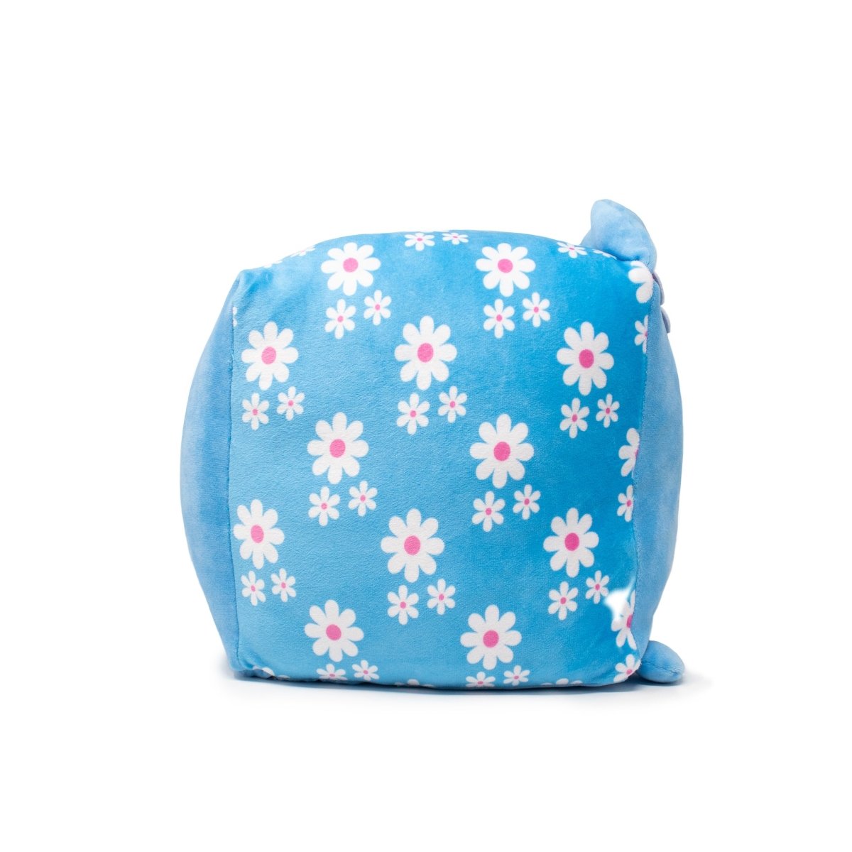 The light blue Maisie the Cat Plushie resembles a plush toy with white flowers having pink centers. This square, soft cushion features a plush texture and a delightful ear-like detail in one corner.