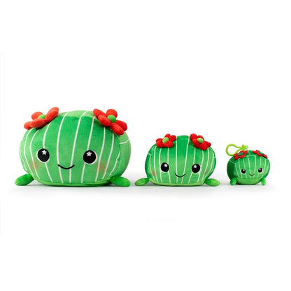 Three Maya the Cactus Plush Clip-On toys from Moosh-Moosh Series 5 resemble round, green cacti with vertical stripes, smiling faces, and red flowers. They vary in size and are lined up from largest to smallest against a plain white background.