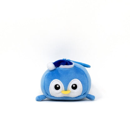 Peckington the Penguin Clip-On is an adorable round plush toy in soft blue with a small blue and white hat, featuring large embroidered eyes and a yellow beak against a plain white background.
