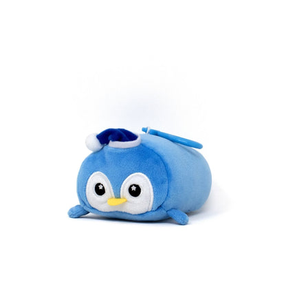 Peckington the Penguin Clip-On, a small blue stuffed penguin with a round body, big eyes, and a yellow beak, rests on a white surface. It wears a tiny blue and white hat, along with a blue handle attached to its top.