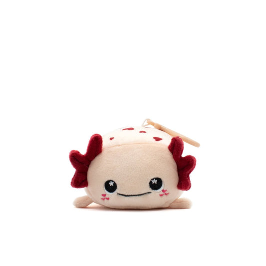 Cael the Axolotl Plush Clip-On is an ultra-soft, cream-colored plush with red gills, smiling face, blushing cheeks, and small embroidered black eyes with white highlights—a perfect Valentine's Day gift against a plain white background.