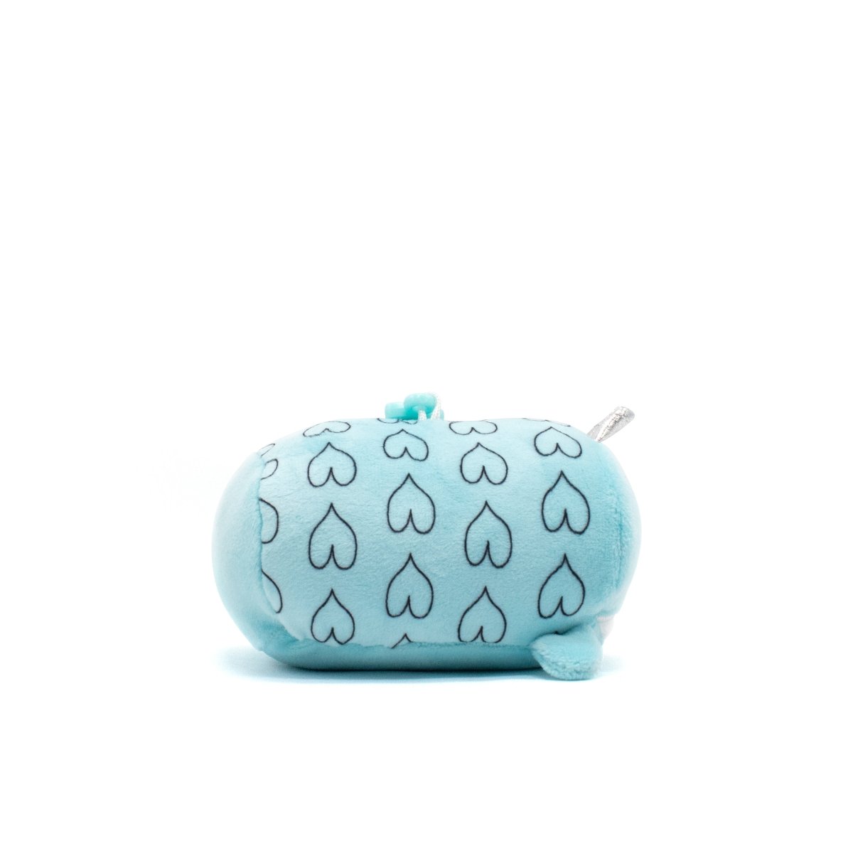 Hershel the Narwhal Plush Clip-On is a soft, light blue plushie with a pattern of black heart outlines. It has small flippers, a tiny tail, and a zipper on top, set against a plain white background.