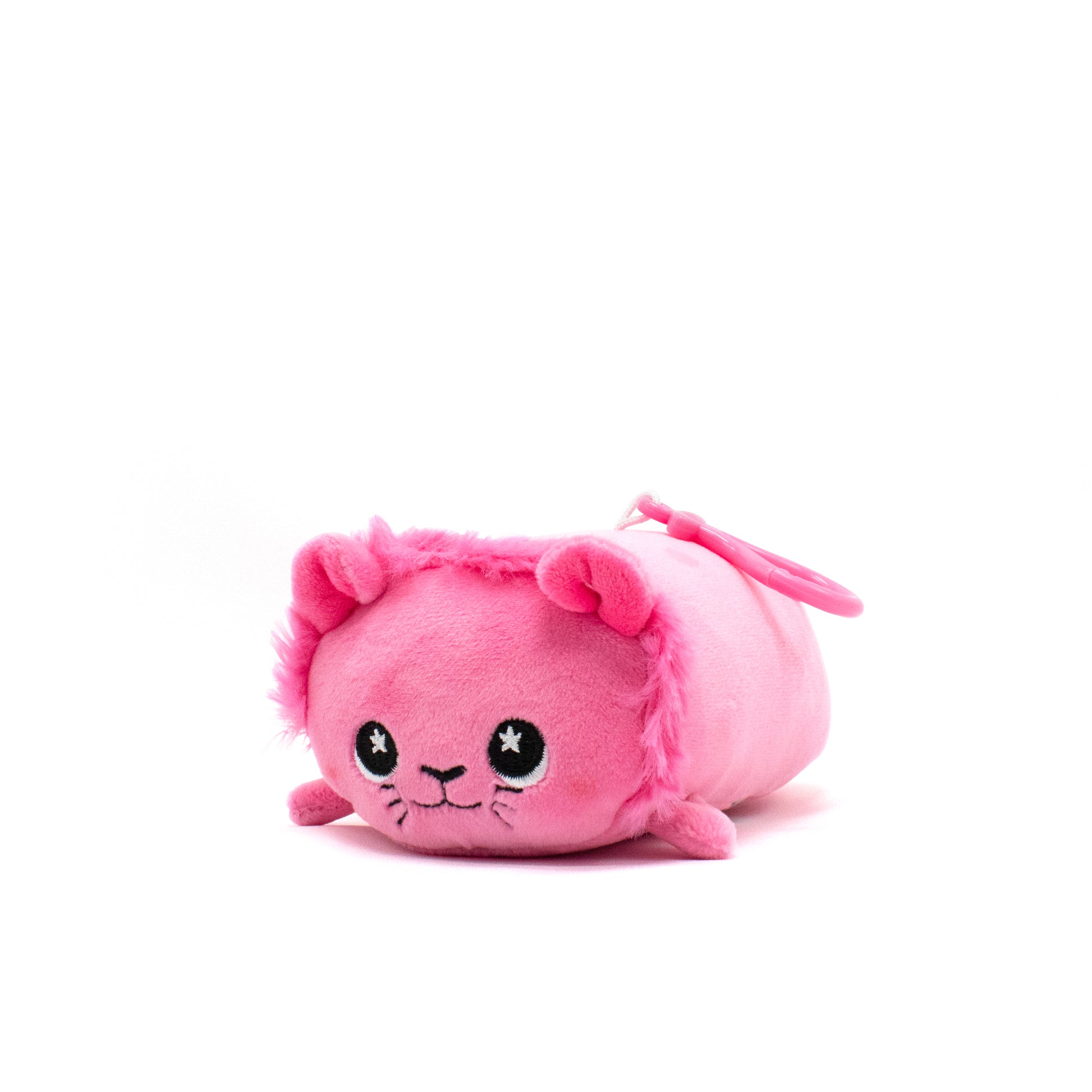 A small, cute pink plushie resembling Prince Val the Lion with a round body, big embroidered eyes, and tiny ears. This adorable stuffed animal features a clip-on attachment at the back against a plain white background.