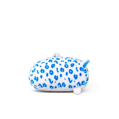 Snowie the Snow Leopard Clip-On is a small, oval plush with white fabric, bright blue spots, tiny ears, and a short tail. This cute cartoon-style animal is perfect as a plush keychain and is shown on a plain white background.