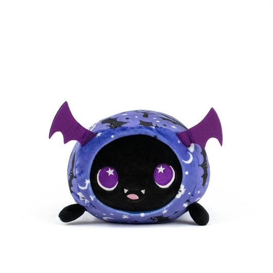 Cassie Spooky Slumber Plushie is a round, ultra-soft bat toy with purple wings, big purple eyes, a small smiling mouth, and a starry blue and black body, pictured against a plain white background.