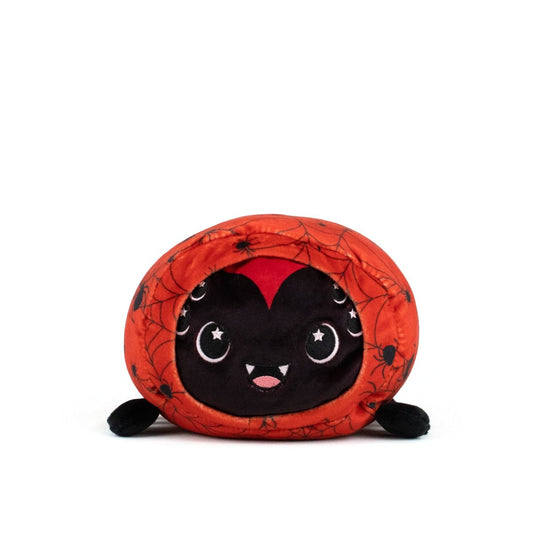 The Muffet Spooky Slumber Plushie is a round, ultra-soft plush toy with a smiling black face, fangs, and starry eyes, wrapped in an orange cover featuring black spider and web designs.