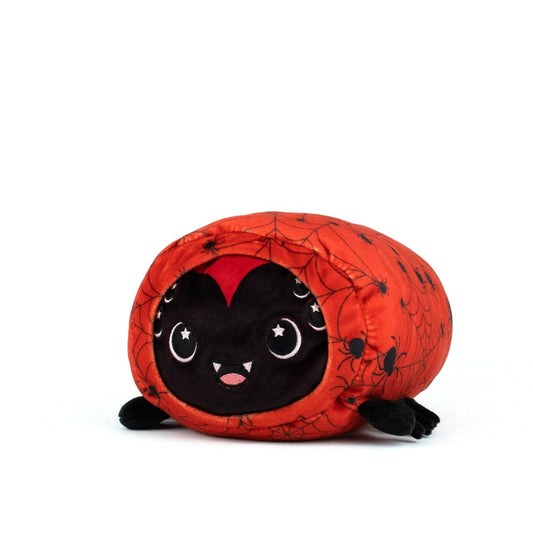 The Muffet Spooky Slumber Plushie is a round, ultra-soft stuffed toy shaped like a spider with a black face, small fangs, embroidered eyes, and an orange body featuring web details. This cuddly plushie is machine washable and photographed on a plain white background.