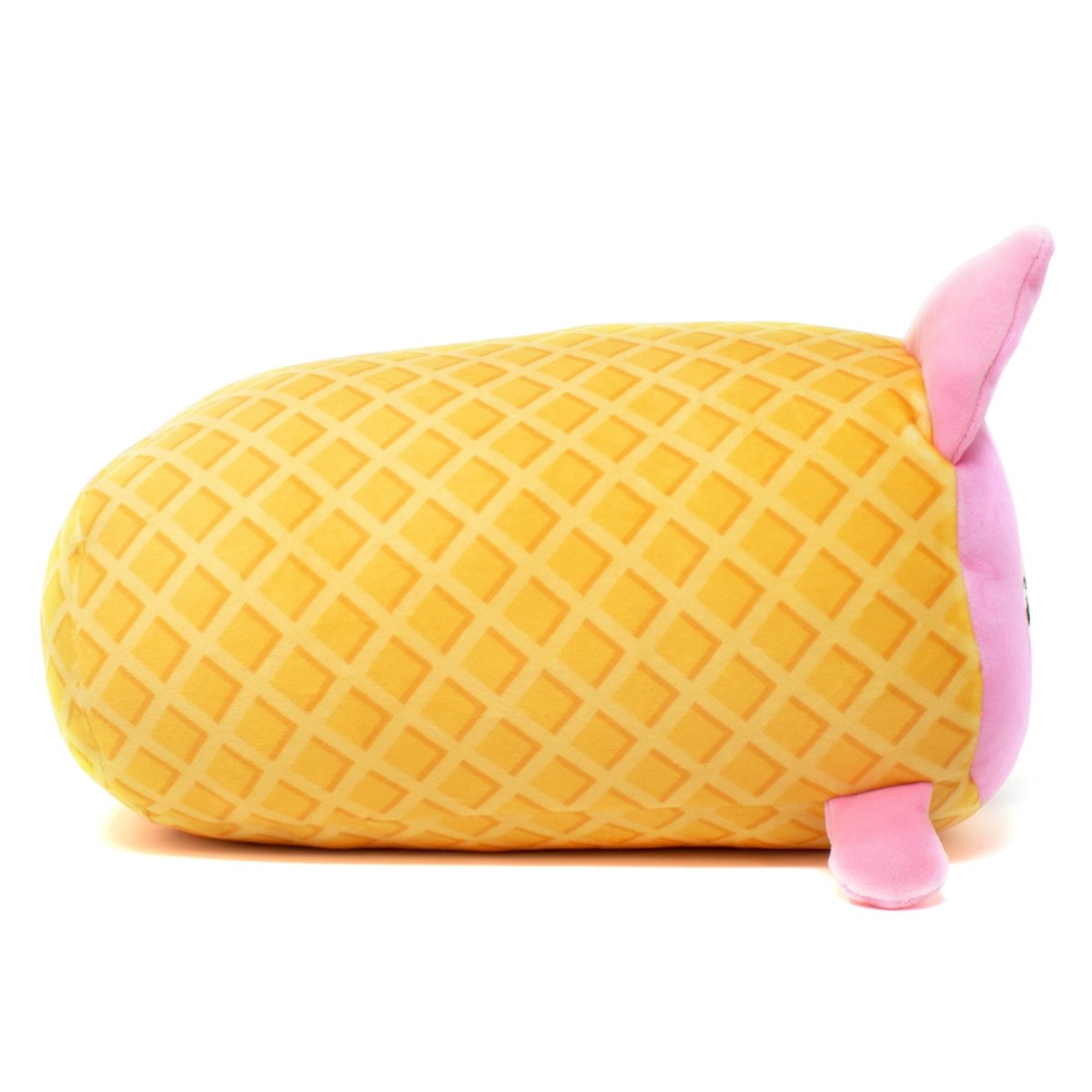 Napoleon the Ice Cream Plushie is an adorable toy shaped like a loaf of bread, featuring a yellow crisscross pattern resembling a melon pan. It has a pink face and ears, lying on its side, making it irresistible for any plushie collection.