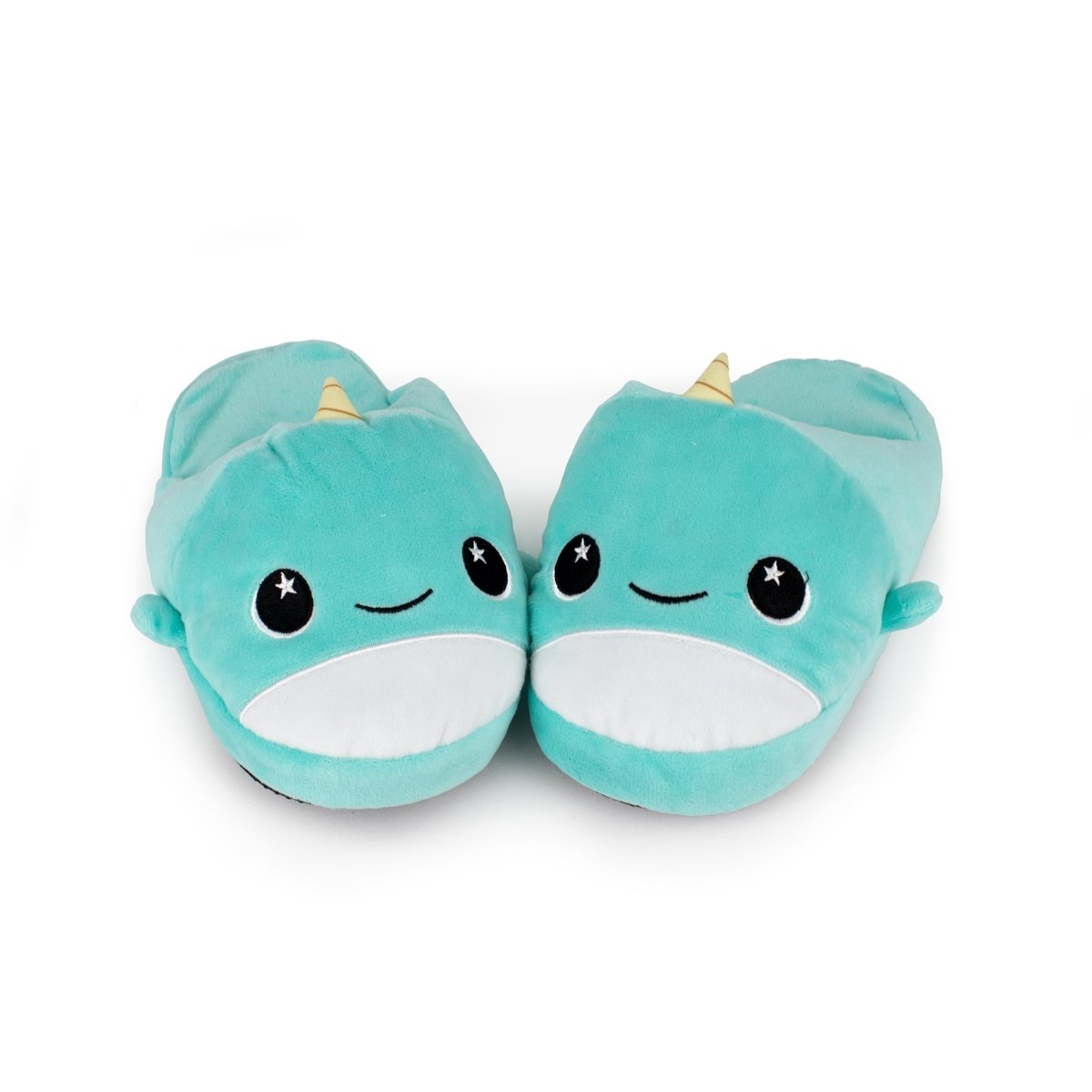 Minthe the Narwhal Kids Slipper—a pair of teal kids slippers shaped like cute narwhals, featuring smiling faces, starry eyes, white bellies, and yellow horns. Soft plush house slippers shown on a white background.