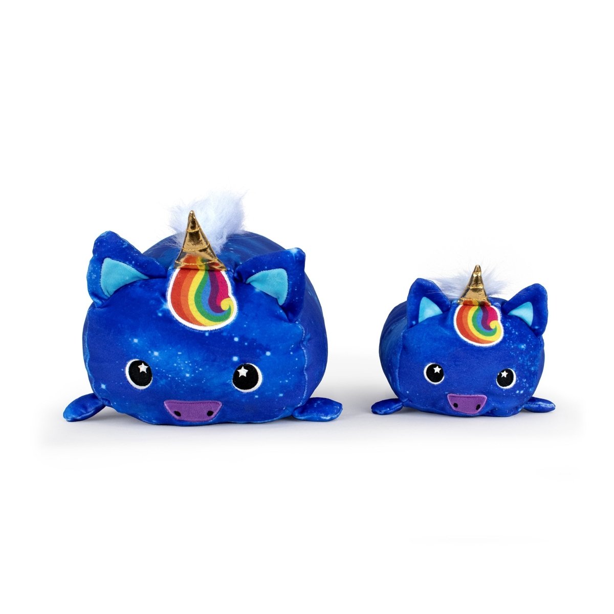Two Nightwind the Unicorn plushies with blue fur, rainbow horns, starry eyes, purple snouts, and white fluffy manes sit side by side on a white background. The left one is larger. Both are cute and cuddly companions.
