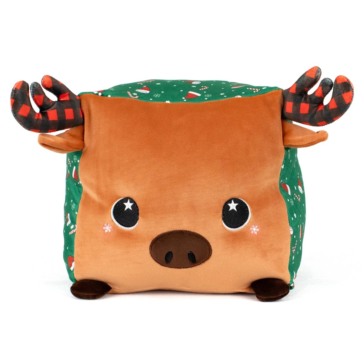 Noel the Moose is a plush, square pillow with a brown face, black nose, starry eyes, rosy cheeks, red-and-black plaid antlers, and green sides adorned with holiday candy cane and Christmas decoration patterns.