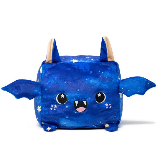 Orion the Bat Plushie is a cute blue square bat with a starry pattern, featuring large ears, small wings, and a cheerful face with an open mouth, fangs, black eyes against a white backdrop.