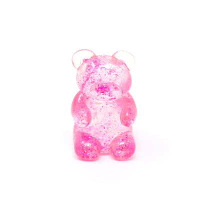 Introducing Bubblegum’s Favorite Toy - Glitter Maltose Bears: a translucent pink gummy bear figurine filled with shimmering glitter, sitting upright against a plain white background—a delightful sensory toy perfect for squishy stress relief.