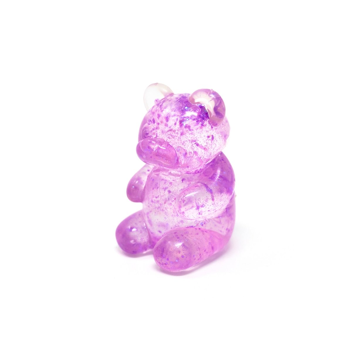 A translucent purple Glitter Maltose Bear from Bubblegum’s Favorite Toy sits upright on a white background, resembling a squishy stress relief sensory toy.