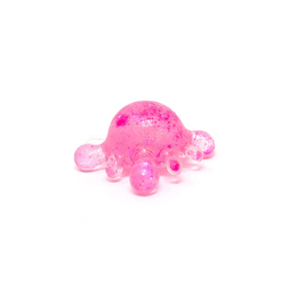 Centered on a white background, Bubblegum’s Favorite Toy - Splat Squishy appears as a small, translucent pink blob with rounded protrusions, reminiscent of a sensory toy or abstract sculpture.