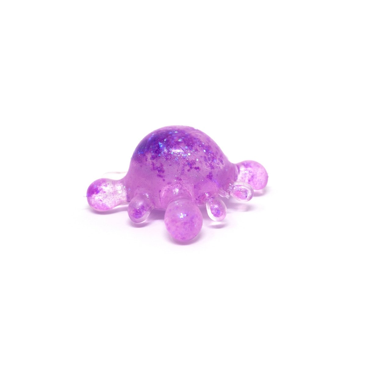 A small, translucent purple blob with glitter and six rounded protrusions, resembling a jelly or slime toy, sits on a white background. This adorable sensory toy is Bubblegum’s Favorite Toy - Splat Squishy, perfect as a stress-relief squishy for playful squeezing and relaxation.