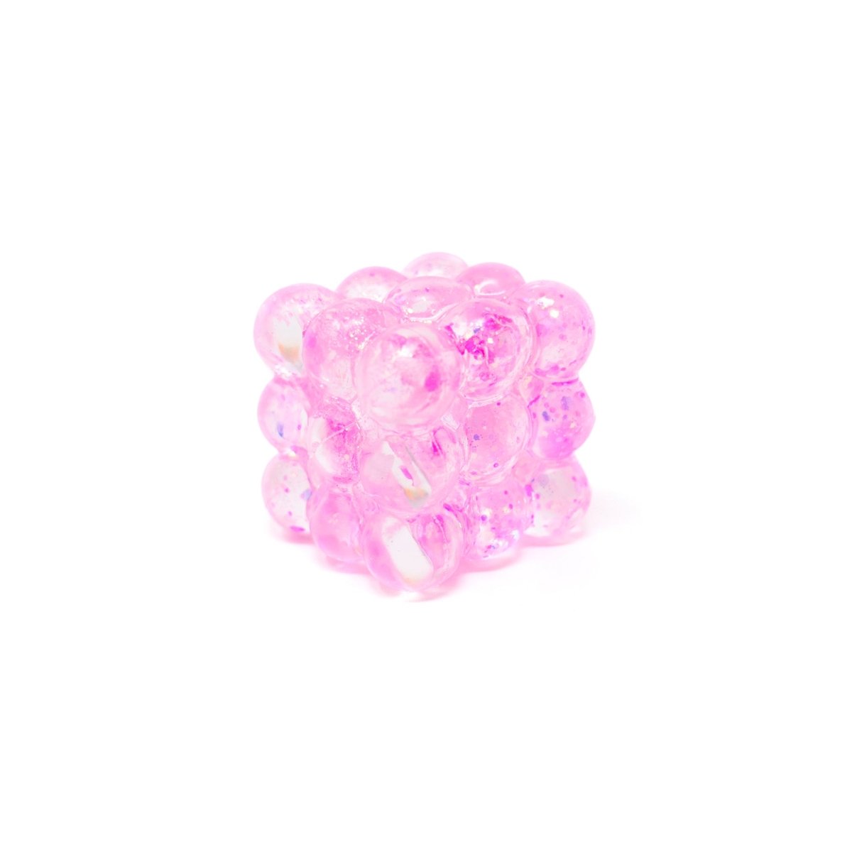 A small pink Glitter Bubble Cube from Bubblegum’s Favorite Toy, crafted from translucent, glittery beads arranged in a 3x3 formation on each side, is displayed against a white background.